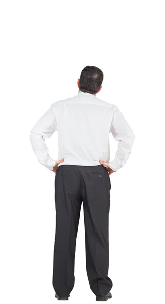 Businessman with hands on hips — Stock Photo, Image