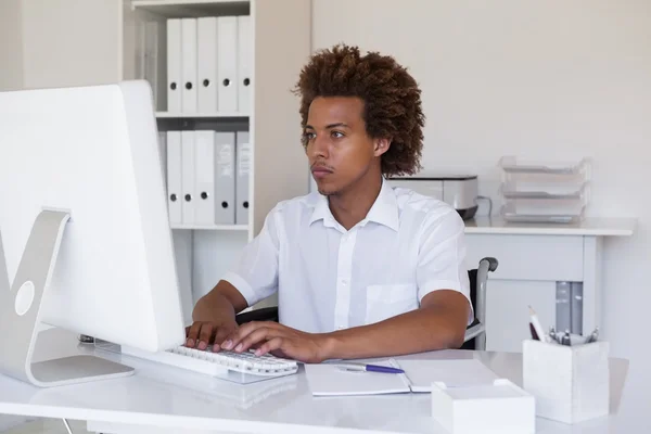 Businessman in wheelchair working at his desk — Stock Photo, Image