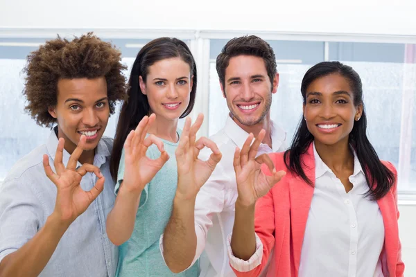 Workers giving OK gesture — Stock Photo, Image