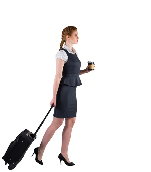 Businesswoman pulling her suitcase — Stock Photo, Image