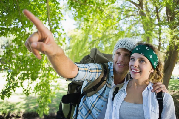 Couple on a hike with man pointing — Stock Photo, Image
