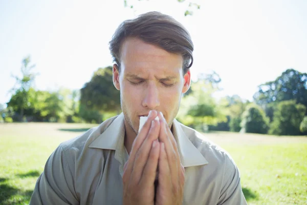 Stylish man blowing his nose — Stock Photo, Image