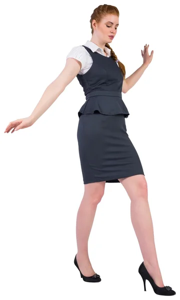 Businesswoman doing a balancing act — Stock Photo, Image