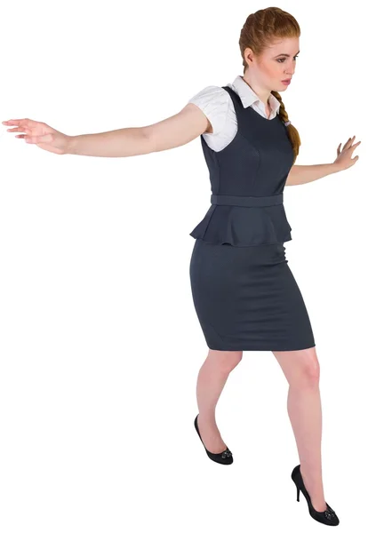 Businesswoman doing a balancing act — Stock Photo, Image