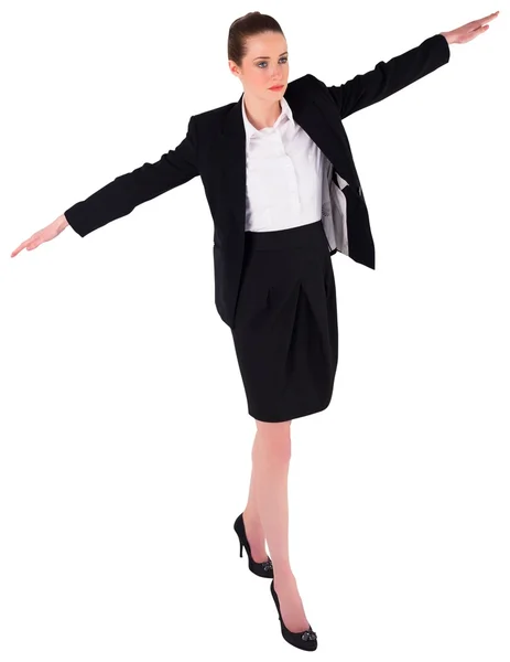 Businesswoman performing a balancing act — Stock Photo, Image