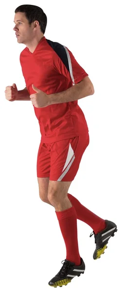 Fußballer in roter Jogginghose — Stockfoto