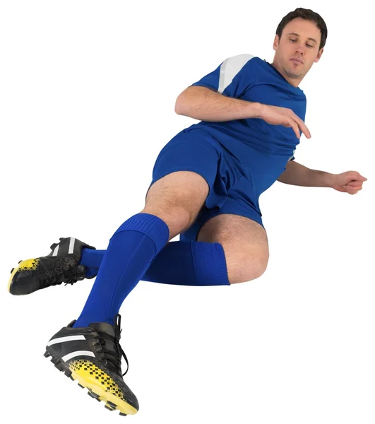 蓝色踢的足球运动员 — 图库照片