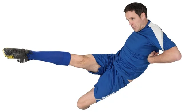 Football player in blue kicking — Stock Photo, Image