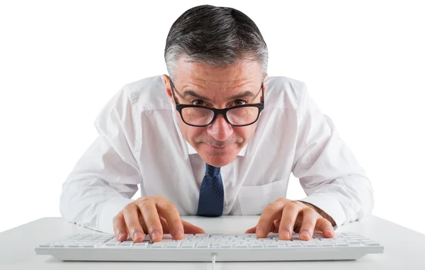 Mature businessman typing on keyboard — Stock Photo, Image