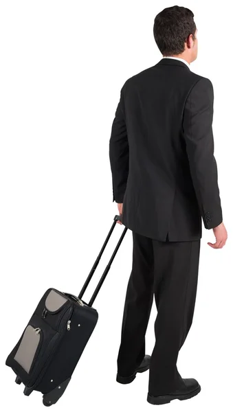 Geschäftsmann zieht seinen Koffer — Stockfoto