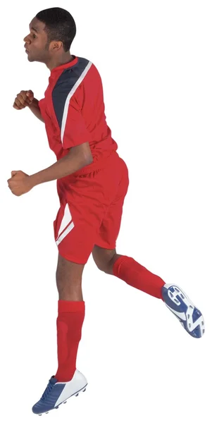 Jogador de futebol pulando — Fotografia de Stock