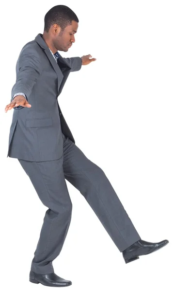 Businessman performing a balancing act — Stock Photo, Image