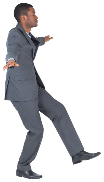 Businessman performing a balancing act — Stock Photo, Image