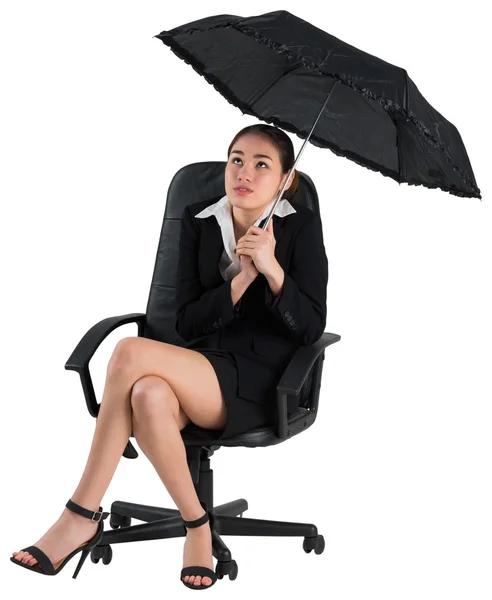 Businesswoman holding umbrella — Stock Photo, Image