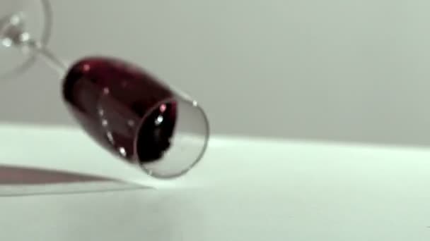 Glass of wine falling and spilling — Stock Video