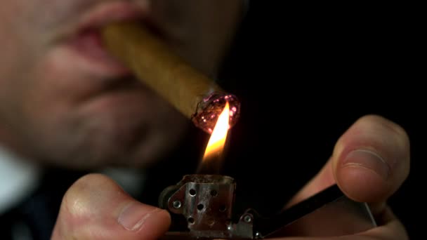 Businessman lighting his cigar — Stock Video