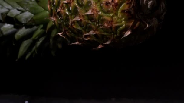 Pineapple falling and splitting — Stock Video