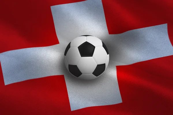 Fotboll mot schweiziska flaggan — Stockfoto