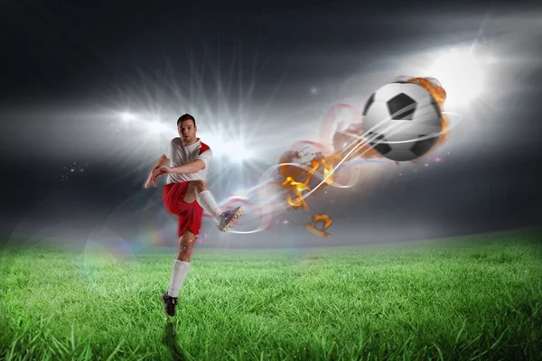 Football player in white kicking — Stock Photo, Image