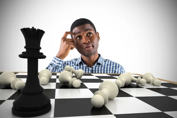 Thinking businessman with chessboard — Stock Photo, Image