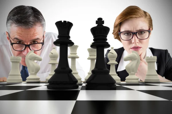 Business people and chessboard — Stock Photo, Image