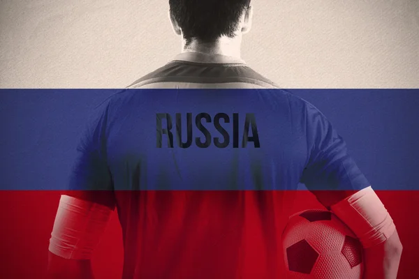 Rússia jogador de futebol segurando bola — Fotografia de Stock