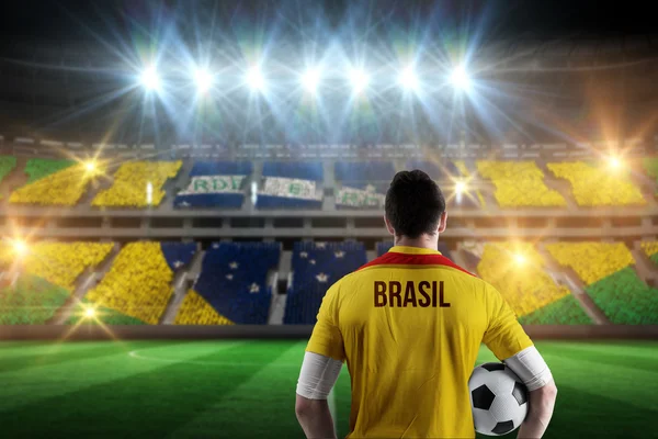 Brasil football player holding ball — Stock Photo, Image