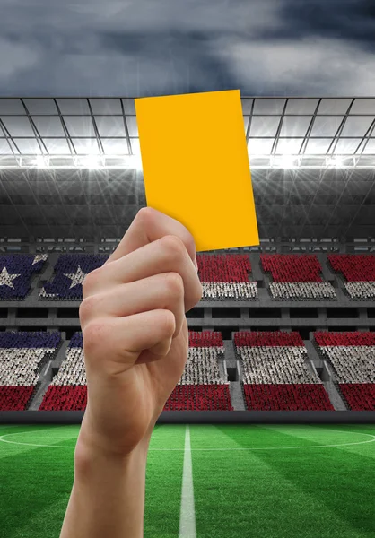 Hand holding up yellow card — Stock Photo, Image