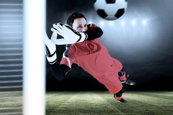 Fit goal keeper jumping up — Stock Photo, Image