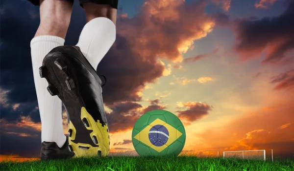 Football boot kicking brazil ball — Stock Photo, Image