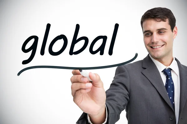 Empresário escrevendo palavra global — Fotografia de Stock
