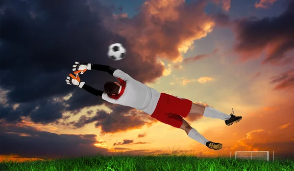 Goalkeeper in white jumping up — Stock Photo, Image