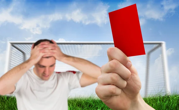 Hand holding up red card to player — Stok fotoğraf