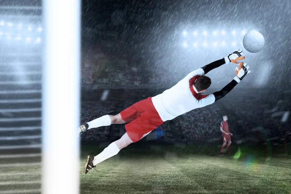 Goalkeeper in white jumping up — Stock Photo, Image