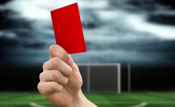 Mão segurando cartão vermelho — Fotografia de Stock