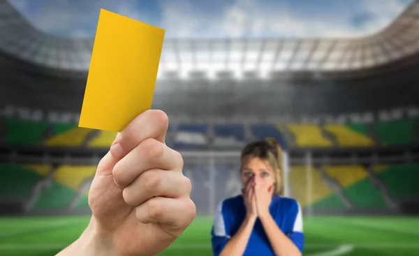 Hand holding up yellow card — Stock Photo, Image