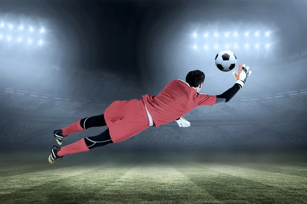 Fit goal keeper jumping up — Stock Photo, Image