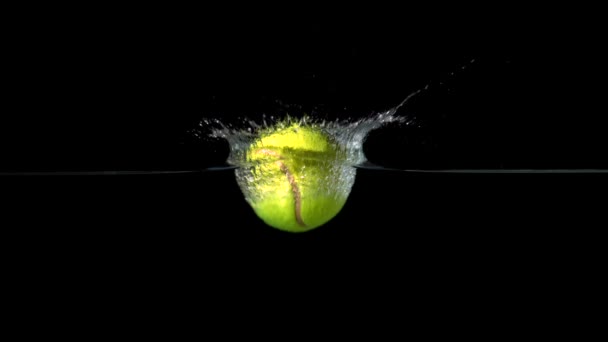 Tennis ball falling into water — Stock Video
