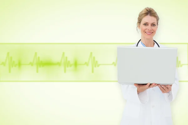 Blonde doctor using laptop — Stock Photo, Image