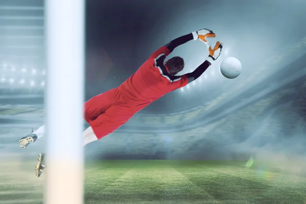 Goalkeeper in red jumping up — Stock Photo, Image