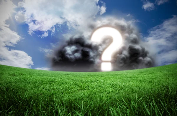 Question mark in cloud against green field — Stock Photo, Image
