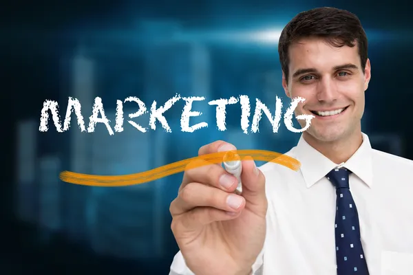 Businessman writing word marketing — Stock Photo, Image