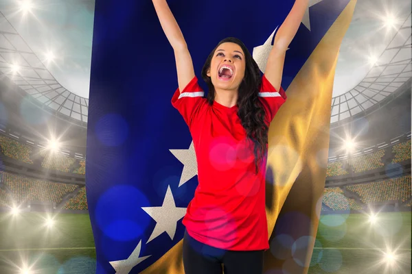 Football fan holding bosnian flag — Stock Photo, Image