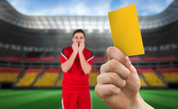Hand holding up yellow card — Stock Photo, Image