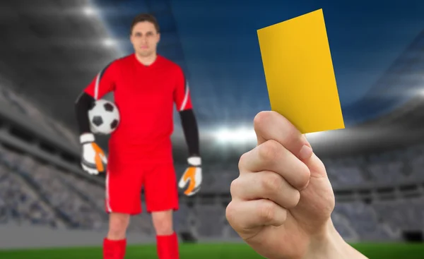 Hand holding up yellow card — Stock Photo, Image