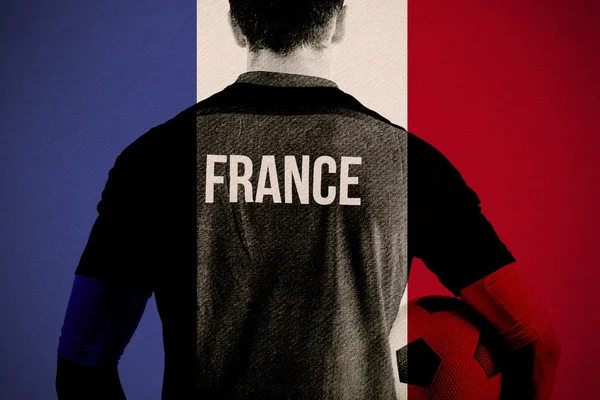 França jogador de futebol segurando bola — Fotografia de Stock
