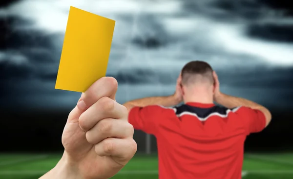 Hand holding up yellow card — Stock Photo, Image