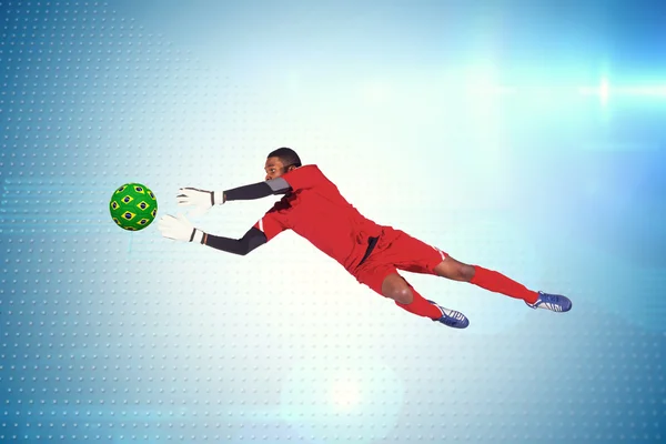 Goalkeeper in red making save — Stock Photo, Image