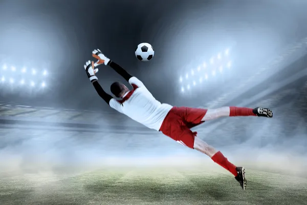 Fit goal keeper jumping up — Stock Photo, Image