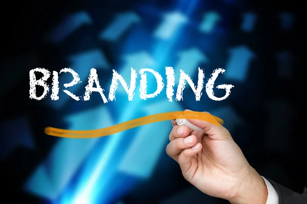 Uomo d'affari scrivere parola di branding — Foto Stock